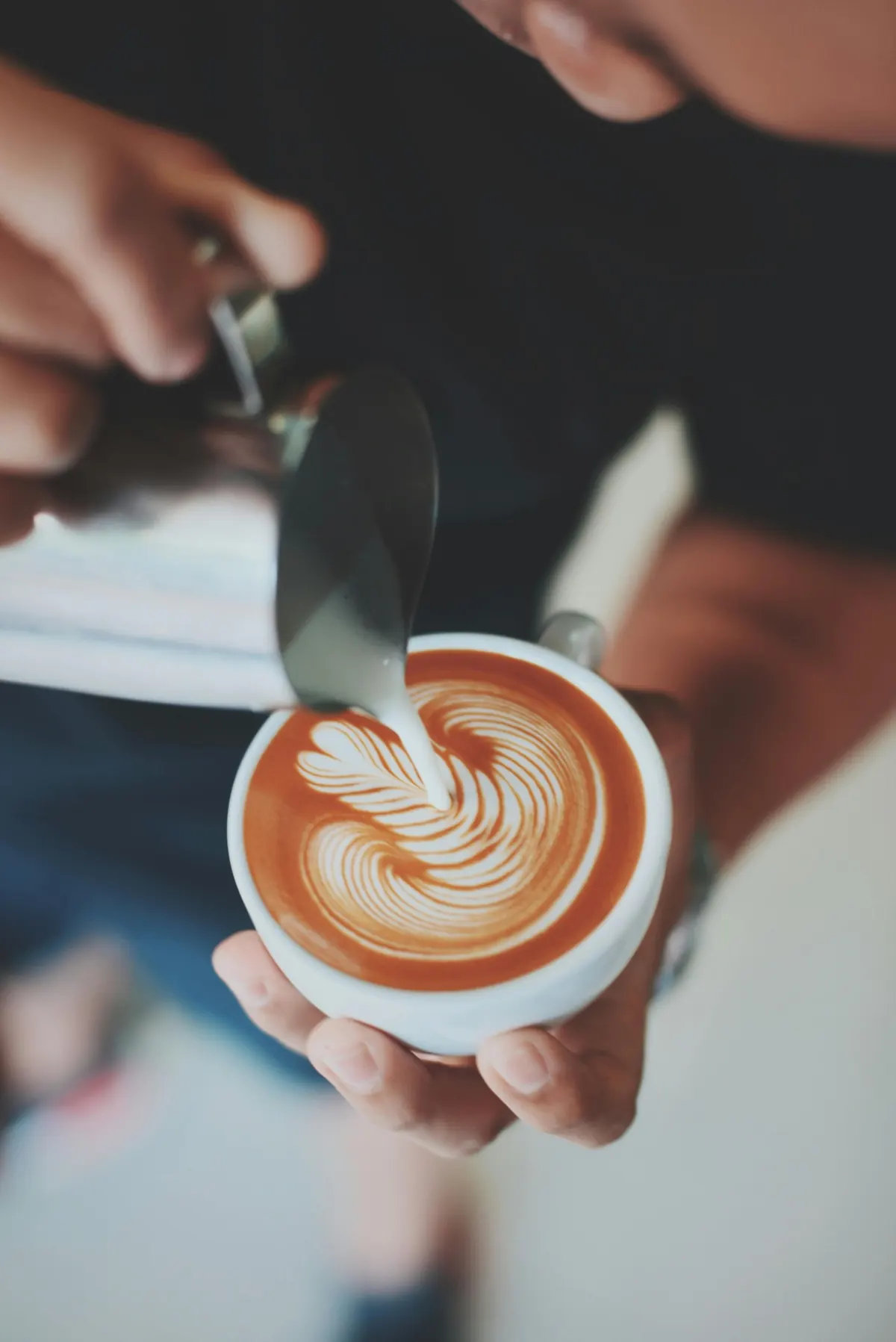 Latte art being poured